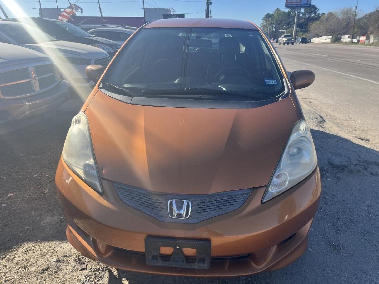 2011 ORANGE HONDA FIT Sport 5-Speed AT (JHMGE8H57BC) with an 1.5L L4 SOHC 16V engine, AUTOMATIC transmission, located at 2303 West Mt. Houston, Houston, 77038, (281) 507-3956, 29.771597, -95.339569 - Photo#0