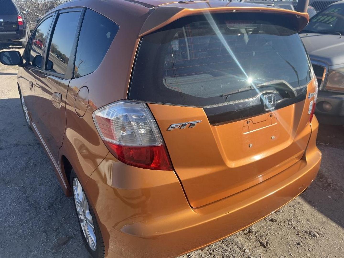 2011 ORANGE HONDA FIT Sport 5-Speed AT (JHMGE8H57BC) with an 1.5L L4 SOHC 16V engine, AUTOMATIC transmission, located at 2303 West Mt. Houston, Houston, 77038, (281) 507-3956, 29.771597, -95.339569 - Photo#1