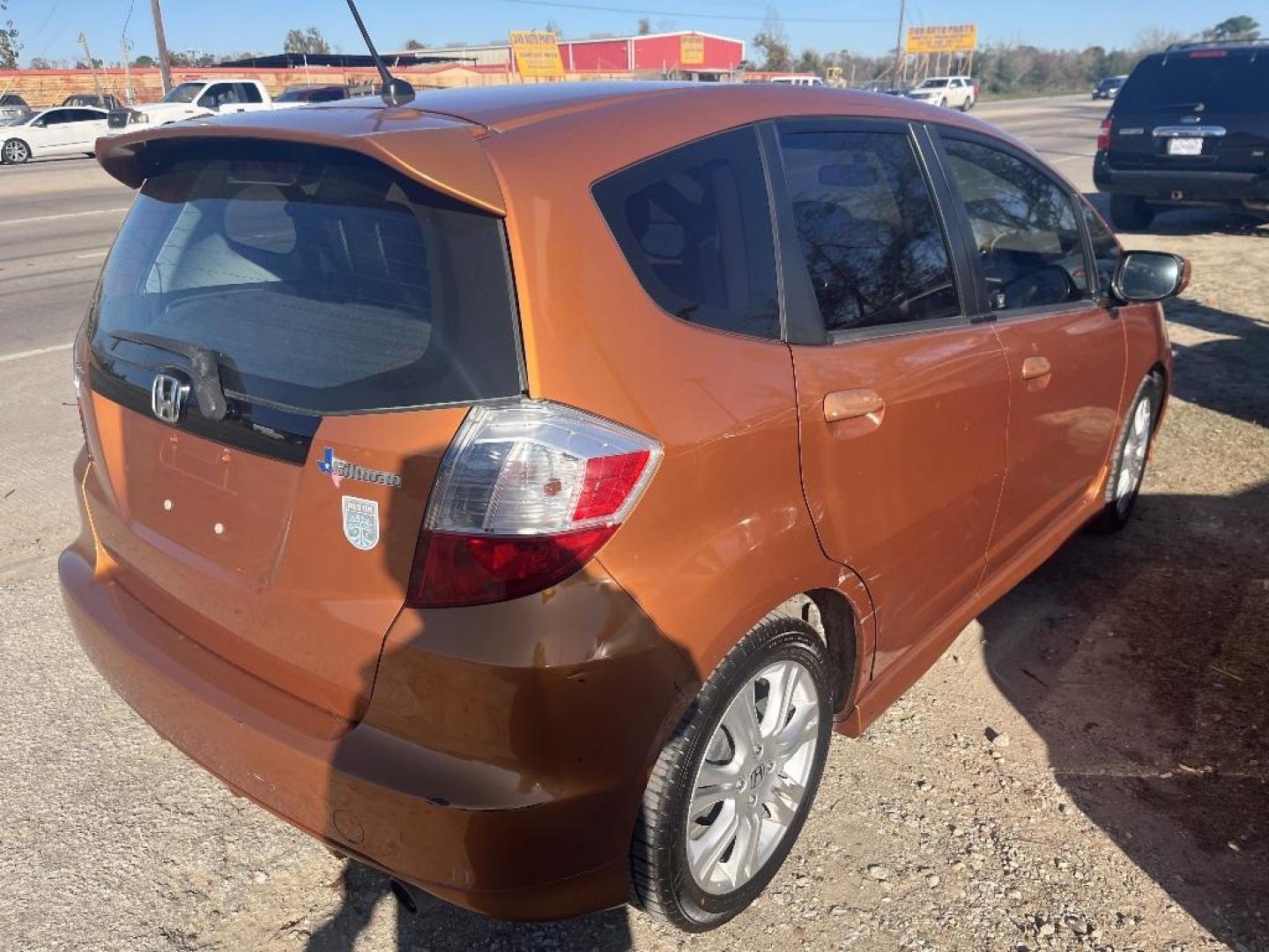 2011 ORANGE HONDA FIT Sport 5-Speed AT (JHMGE8H57BC) with an 1.5L L4 SOHC 16V engine, AUTOMATIC transmission, located at 2303 West Mt. Houston, Houston, 77038, (281) 507-3956, 29.771597, -95.339569 - Photo#5