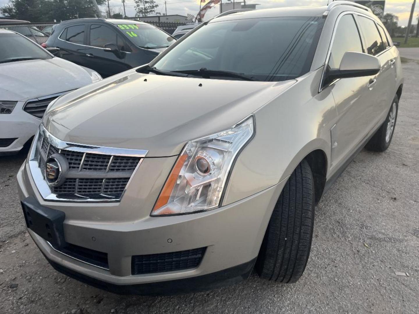 2011 GOLD CADILLAC SRX Luxury Collection (3GYFNAEY1BS) with an 3.0L V6 DOHC 24V engine, AUTOMATIC transmission, located at 2303 West Mt. Houston, Houston, 77038, (281) 507-3956, 29.771597, -95.339569 - Photo#0