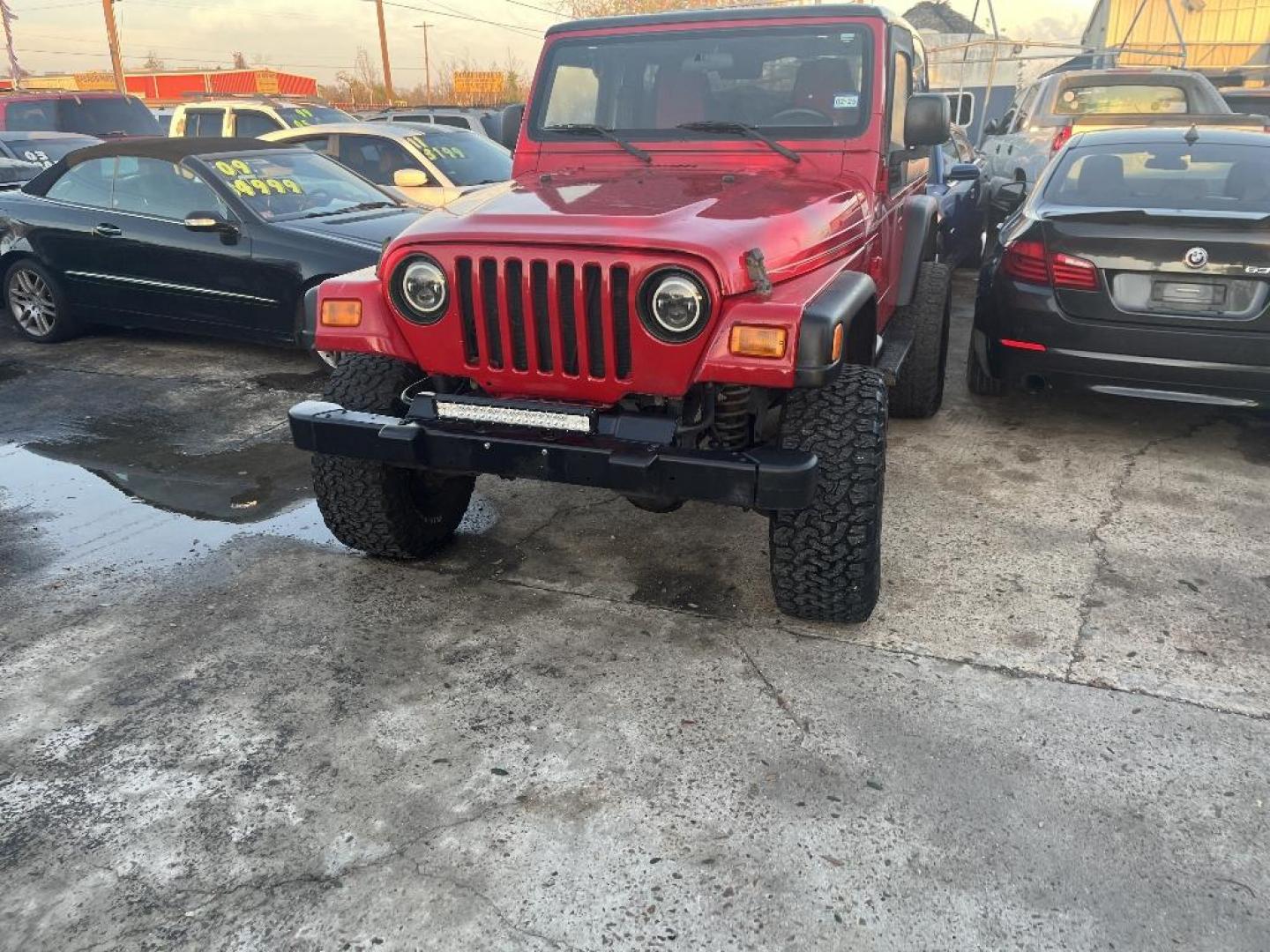 2006 RED JEEP WRANGLER X (1J4FA39S26P) with an 4.0L L6 OHV 12V engine, MANUAL transmission, located at 2303 West Mt. Houston, Houston, 77038, (281) 507-3956, 29.771597, -95.339569 - Photo#0