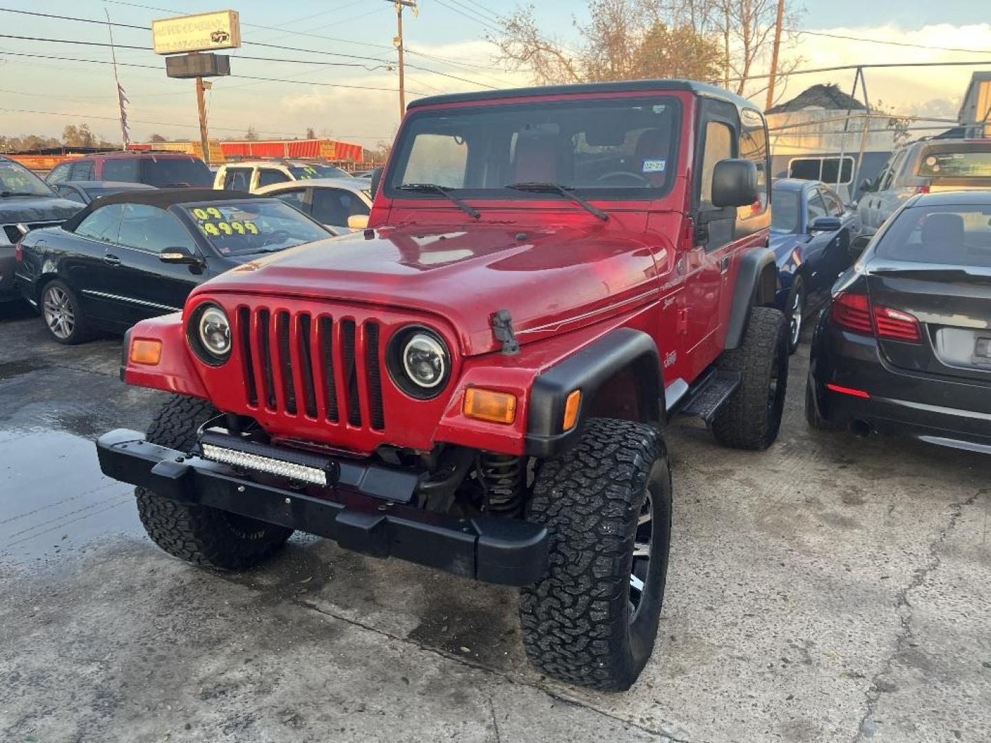 2006 RED JEEP WRANGLER X (1J4FA39S26P) with an 4.0L L6 OHV 12V engine, MANUAL transmission, located at 2303 West Mt. Houston, Houston, 77038, (281) 507-3956, 29.771597, -95.339569 - Photo#1