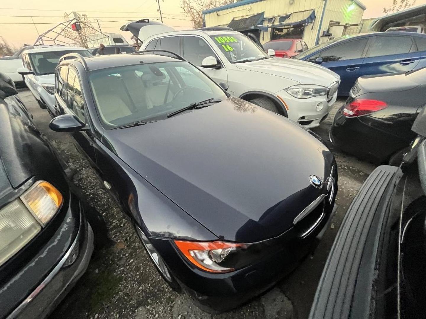 2007 BLACK BMW 3-SERIES SPORT WAGON 328xi (WBAVT73557F) with an 3.0L L6 DOHC 24V engine, AUTOMATIC transmission, located at 2303 West Mt. Houston, Houston, 77038, (281) 507-3956, 29.771597, -95.339569 - Photo#0