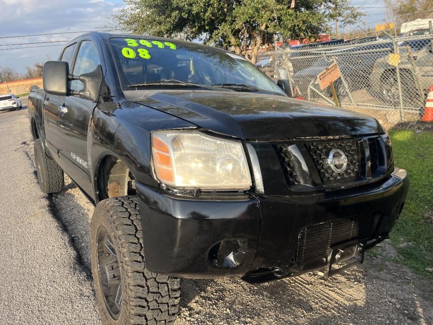 2008 BLACK NISSAN TITAN LE Crew Cab 4WD SWB (1N6AA07C18N) with an 5.6L V8 DOHC 32V engine, AUTOMATIC transmission, located at 2303 West Mt. Houston, Houston, 77038, (281) 507-3956, 29.771597, -95.339569 - Photo#0