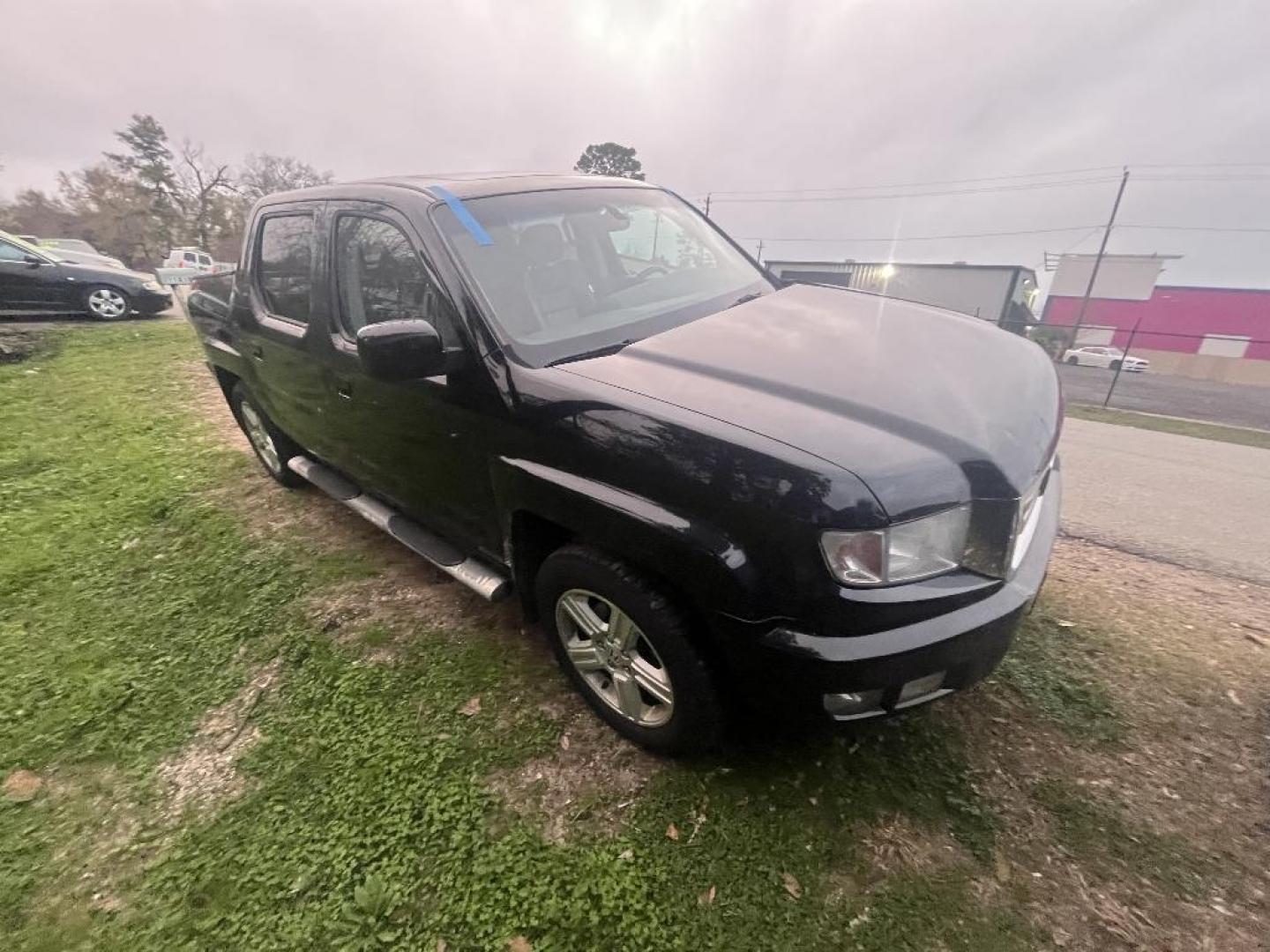 2009 BLACK HONDA RIDGELINE RTL w/ Navigation (5FPYK16599B) with an 3.5L V6 SOHC 24V engine, AUTOMATIC transmission, located at 2303 West Mt. Houston, Houston, 77038, (281) 507-3956, 29.771597, -95.339569 - Photo#1