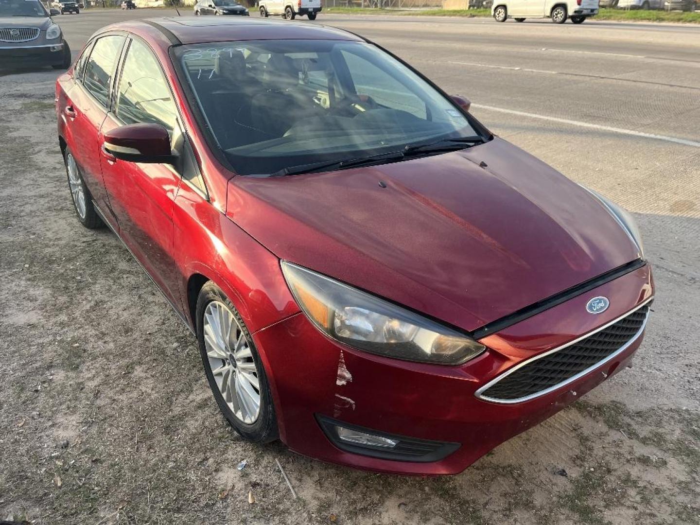 2017 RED FORD FOCUS SEL Sedan (1FADP3H24HL) with an 2.0L L4 DOHC 16V engine, AUTOMATIC transmission, located at 2303 West Mt. Houston, Houston, 77038, (281) 507-3956, 29.771597, -95.339569 - Photo#0