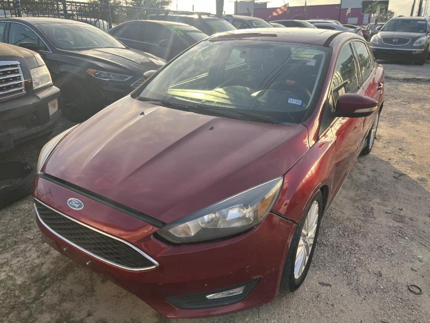 2017 RED FORD FOCUS SEL Sedan (1FADP3H24HL) with an 2.0L L4 DOHC 16V engine, AUTOMATIC transmission, located at 2303 West Mt. Houston, Houston, 77038, (281) 507-3956, 29.771597, -95.339569 - Photo#3