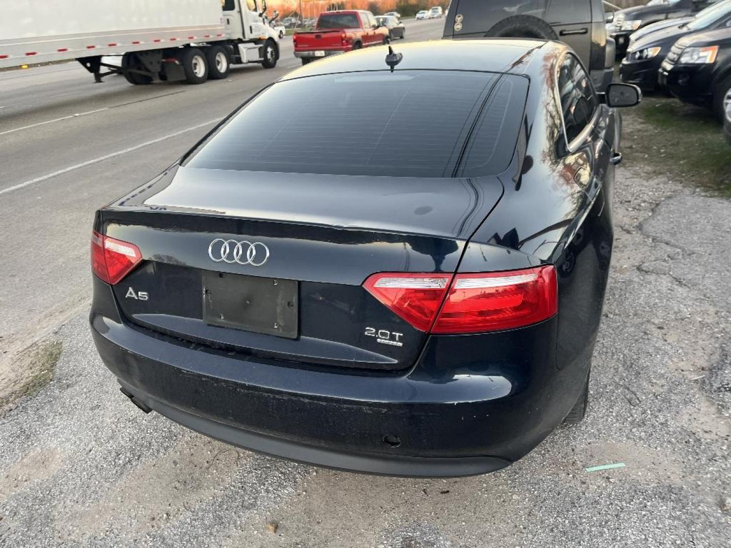 2011 BLACK AUDI A5 Coupe 2.0T quattro Tiptronic (WAUCFAFR6BA) with an 2.0L L4 DOHC 16V TURBO engine, AUTOMATIC transmission, located at 2303 West Mt. Houston, Houston, 77038, (281) 507-3956, 29.771597, -95.339569 - Photo#1