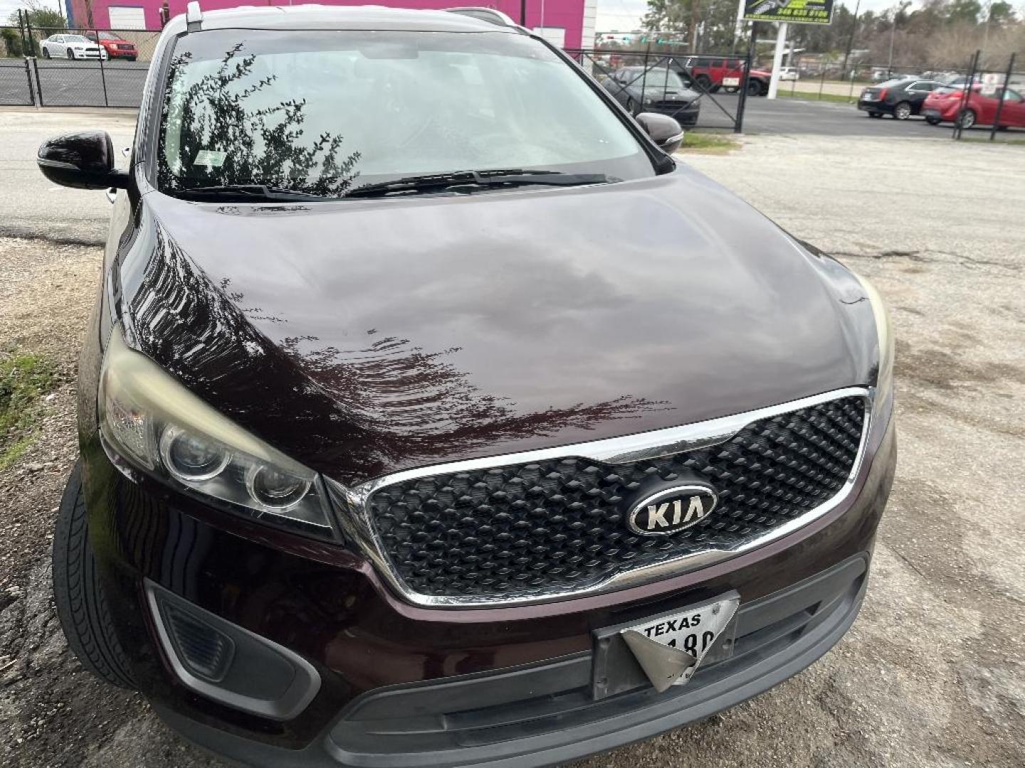 2016 RED KIA SORENTO LX V6 2WD (5XYPG4A51GG) with an 3.3L V6 DOHC 24V engine, AUTOMATIC transmission, located at 2303 West Mt. Houston, Houston, 77038, (281) 507-3956, 29.771597, -95.339569 - Photo#0