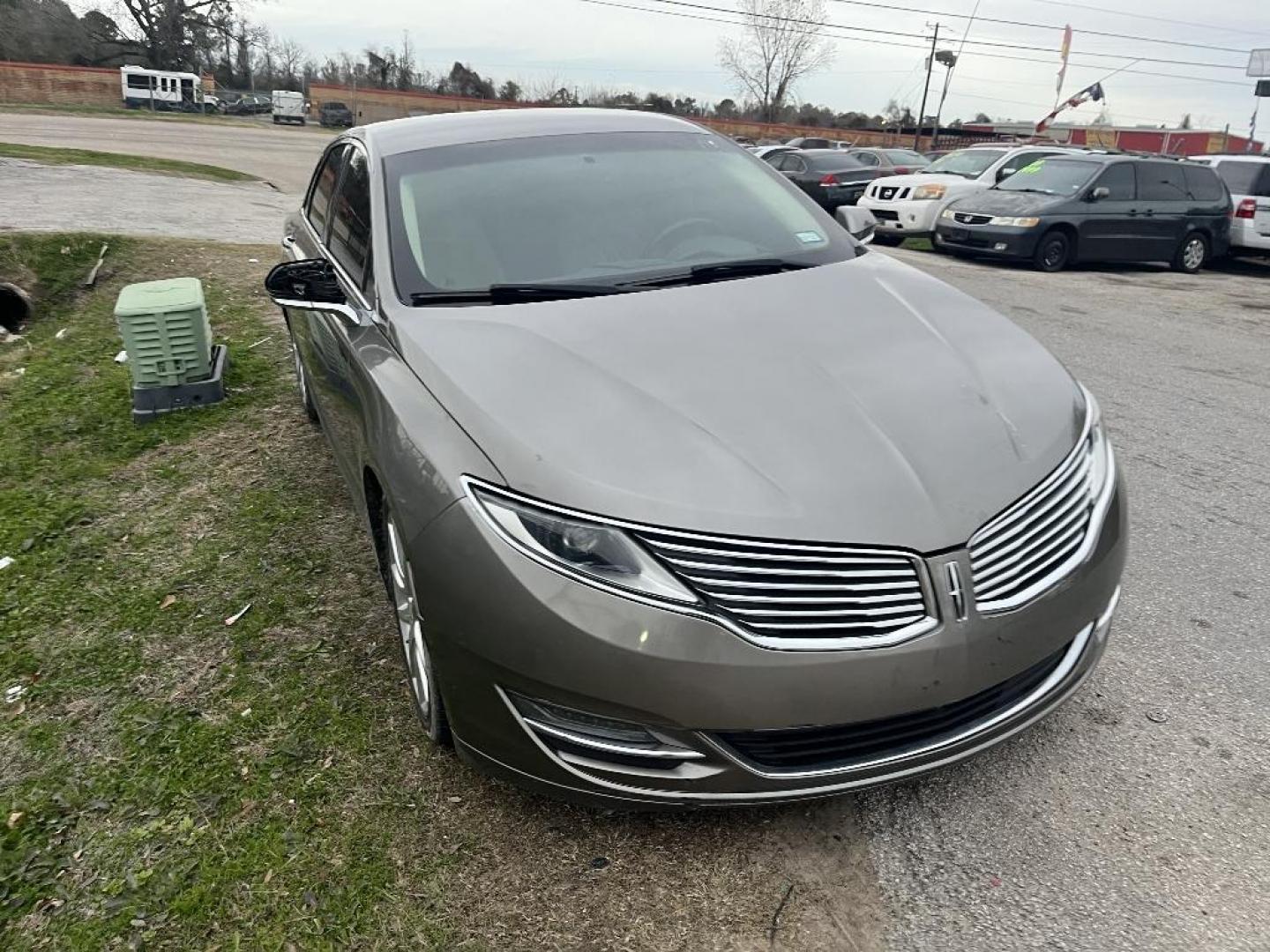 2015 BROWN LINCOLN MKZ HYBRID Sedan (3LN6L2LU0FR) with an 2.0L L4 DOHC 16V HYBRID engine, AUTOMATIC transmission, located at 2303 West Mt. Houston, Houston, 77038, (281) 507-3956, 29.771597, -95.339569 - Photo#2