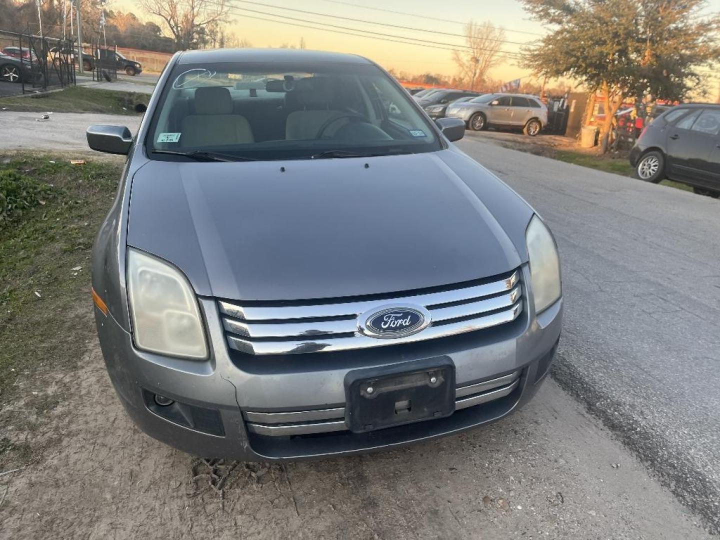 2007 BROWN FORD FUSION V6 SE (3FAHP07127R) with an 3.0L V6 DOHC 24V engine, AUTOMATIC transmission, located at 2303 West Mt. Houston, Houston, 77038, (281) 507-3956, 29.771597, -95.339569 - Photo#4