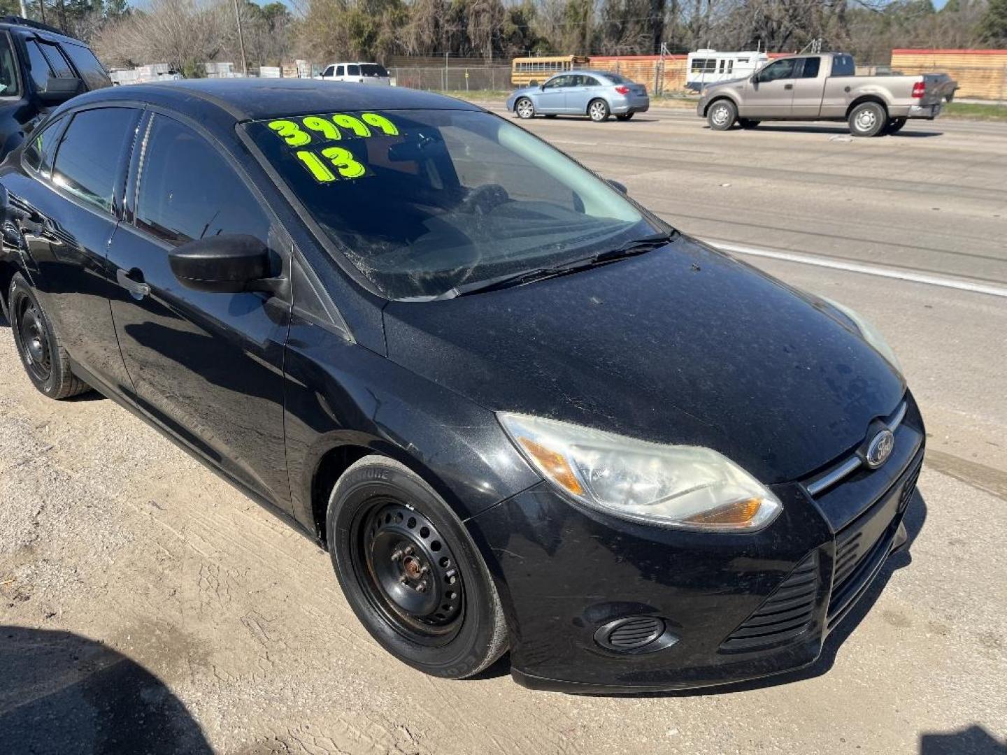 2013 BLACK FORD FOCUS S Sedan (1FADP3E29DL) with an 2.0L L4 DOHC 16V engine, AUTOMATIC transmission, located at 2303 West Mt. Houston, Houston, 77038, (281) 507-3956, 29.771597, -95.339569 - Photo#2