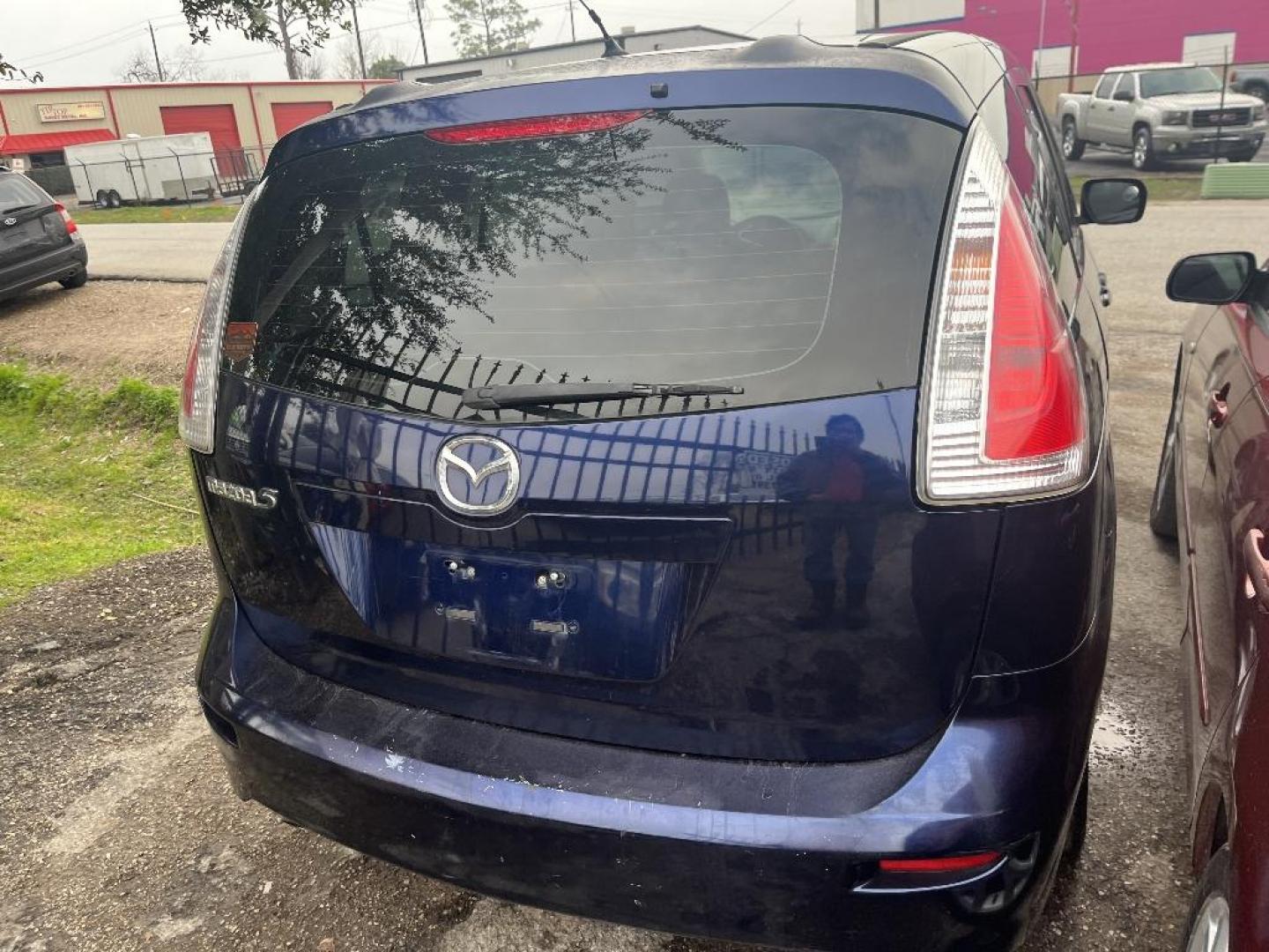 2009 BLUE MAZDA MAZDA5 Grand Touring (JM1CR293890) with an 2.3L L4 DOHC 16V engine, AUTOMATIC transmission, located at 2303 West Mt. Houston, Houston, 77038, (281) 507-3956, 29.771597, -95.339569 - Photo#1