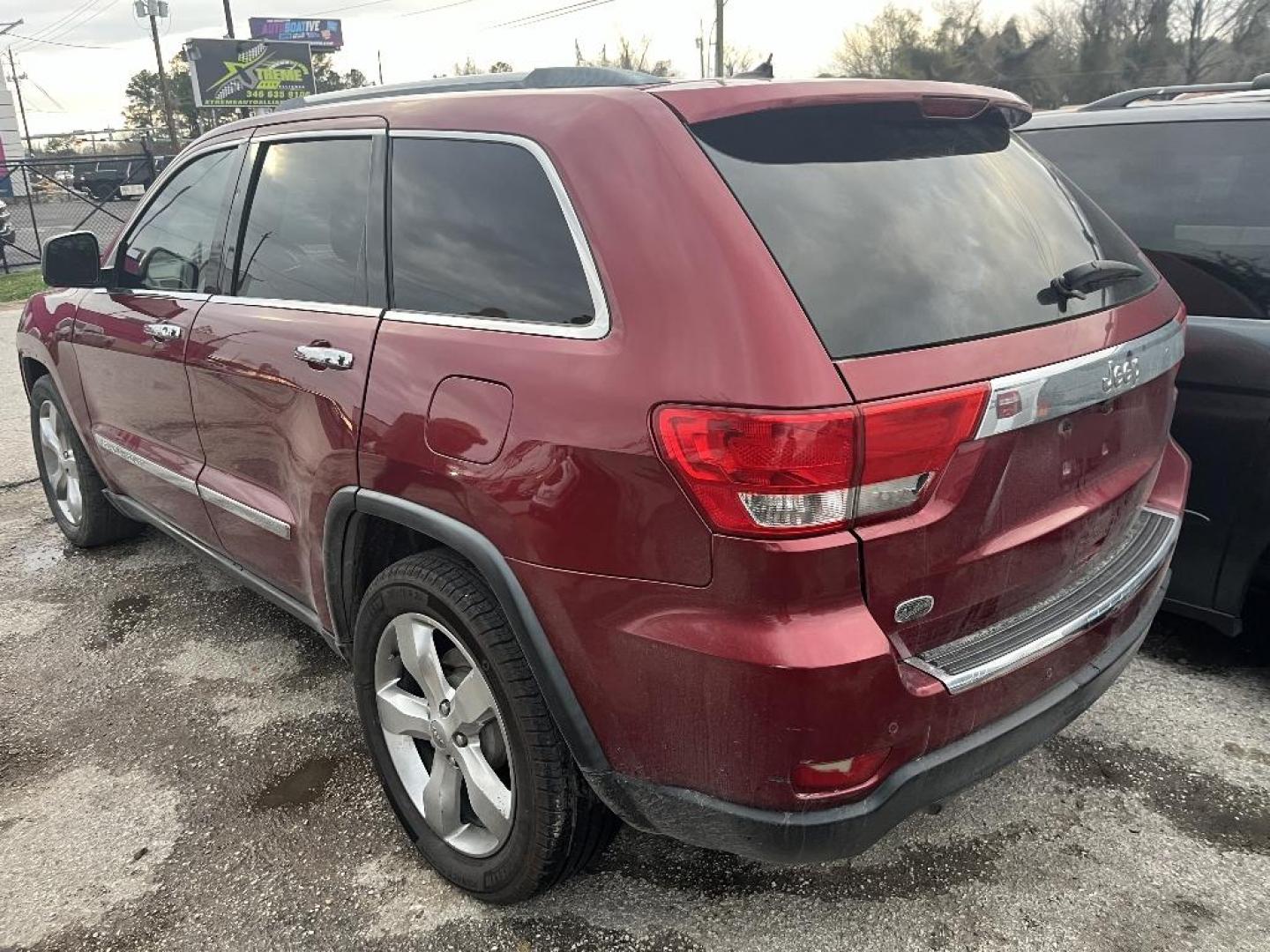 2013 MAROON JEEP GRAND CHEROKEE Overland 2WD (1C4RJECT4DC) with an 5.7L V8 OHV 16V engine, AUTOMATIC transmission, located at 2303 West Mt. Houston, Houston, 77038, (281) 507-3956, 29.771597, -95.339569 - Photo#2