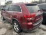 2013 MAROON JEEP GRAND CHEROKEE Overland 2WD (1C4RJECT4DC) with an 5.7L V8 OHV 16V engine, AUTOMATIC transmission, located at 2303 West Mt. Houston, Houston, 77038, (281) 507-3956, 29.771597, -95.339569 - Photo#2