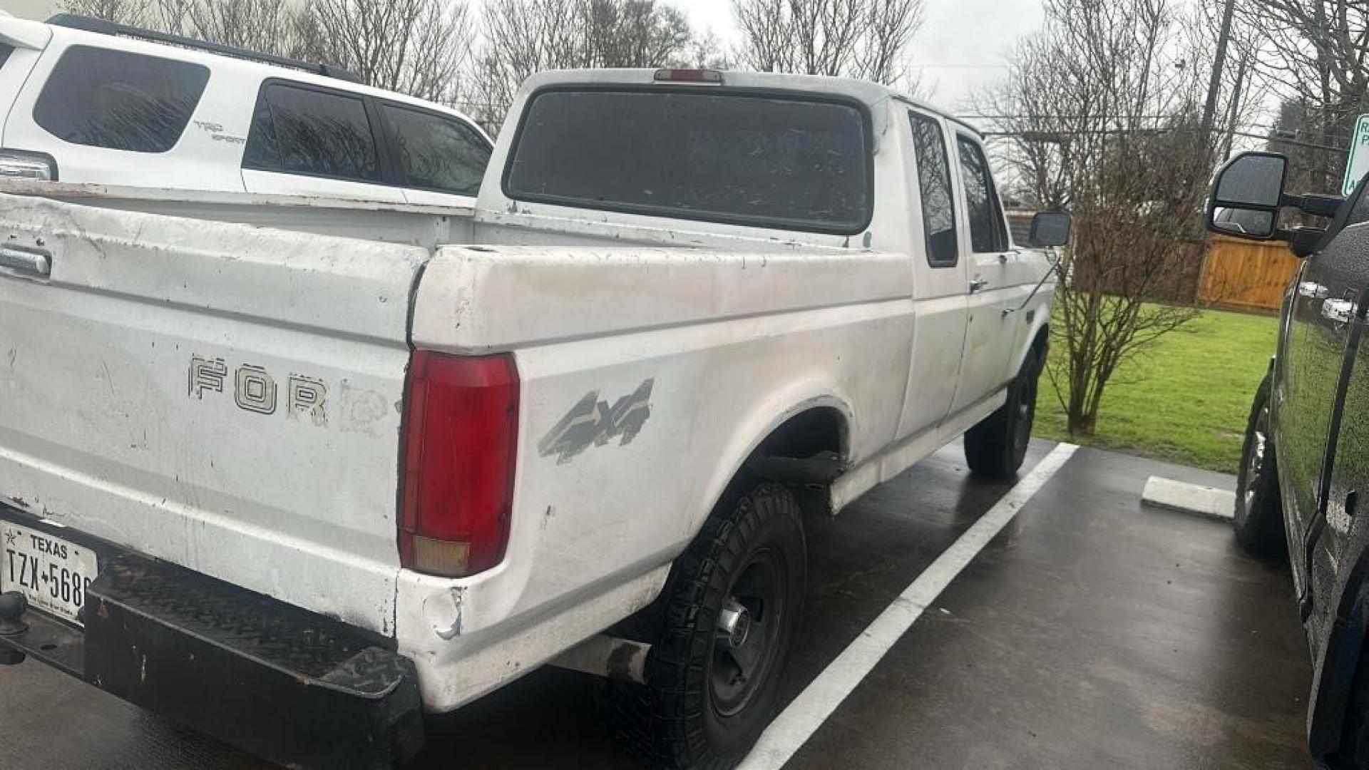 1995 WHITE FORD F-150 XL SuperCab Short Bed 4WD (1FTEX14H7SK) with an 5.8L V8 OHV 16V engine, AUTOMATIC transmission, located at 2303 West Mt. Houston, Houston, 77038, (281) 507-3956, 29.771597, -95.339569 - Photo#2