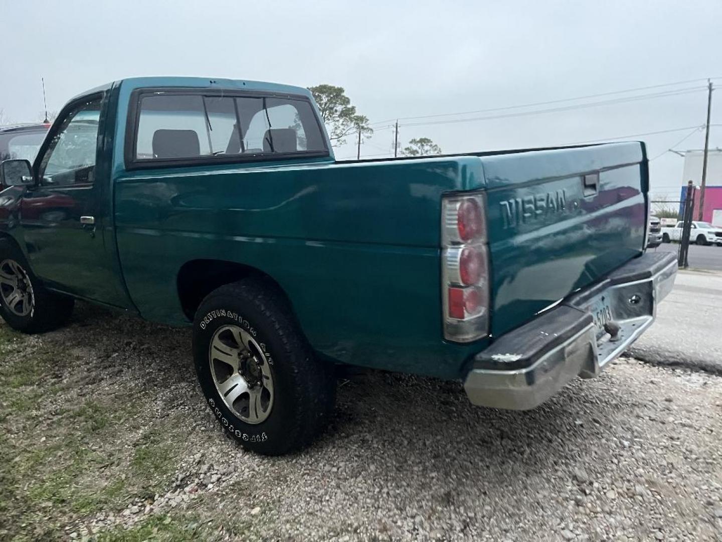 1996 GREEN NISSAN PICKUP Reg. Cab 2WD (1N6SD11S4TC) with an 2.4L L4 SOHC 12V engine, AUTOMATIC transmission, located at 2303 West Mt. Houston, Houston, 77038, (281) 507-3956, 29.771597, -95.339569 - Photo#2