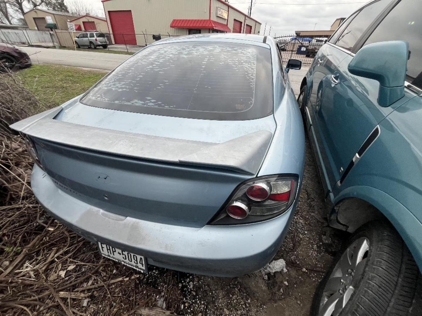 2007 BLUE HYUNDAI TIBURON GS (KMHHM66D47U) with an 2.0L L4 DOHC 16V engine, MANUAL transmission, located at 2303 West Mt. Houston, Houston, 77038, (281) 507-3956, 29.771597, -95.339569 - Photo#5