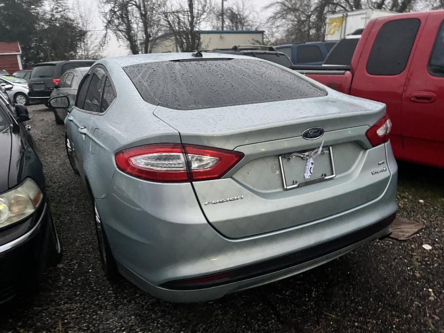 2013 GRAY FORD FUSION HYBRID SE (3FA6P0LU7DR) with an 2.0L L4 DOHC 16V HYBRID engine, AUTOMATIC transmission, located at 2303 West Mt. Houston, Houston, 77038, (281) 507-3956, 29.771597, -95.339569 - Photo#2