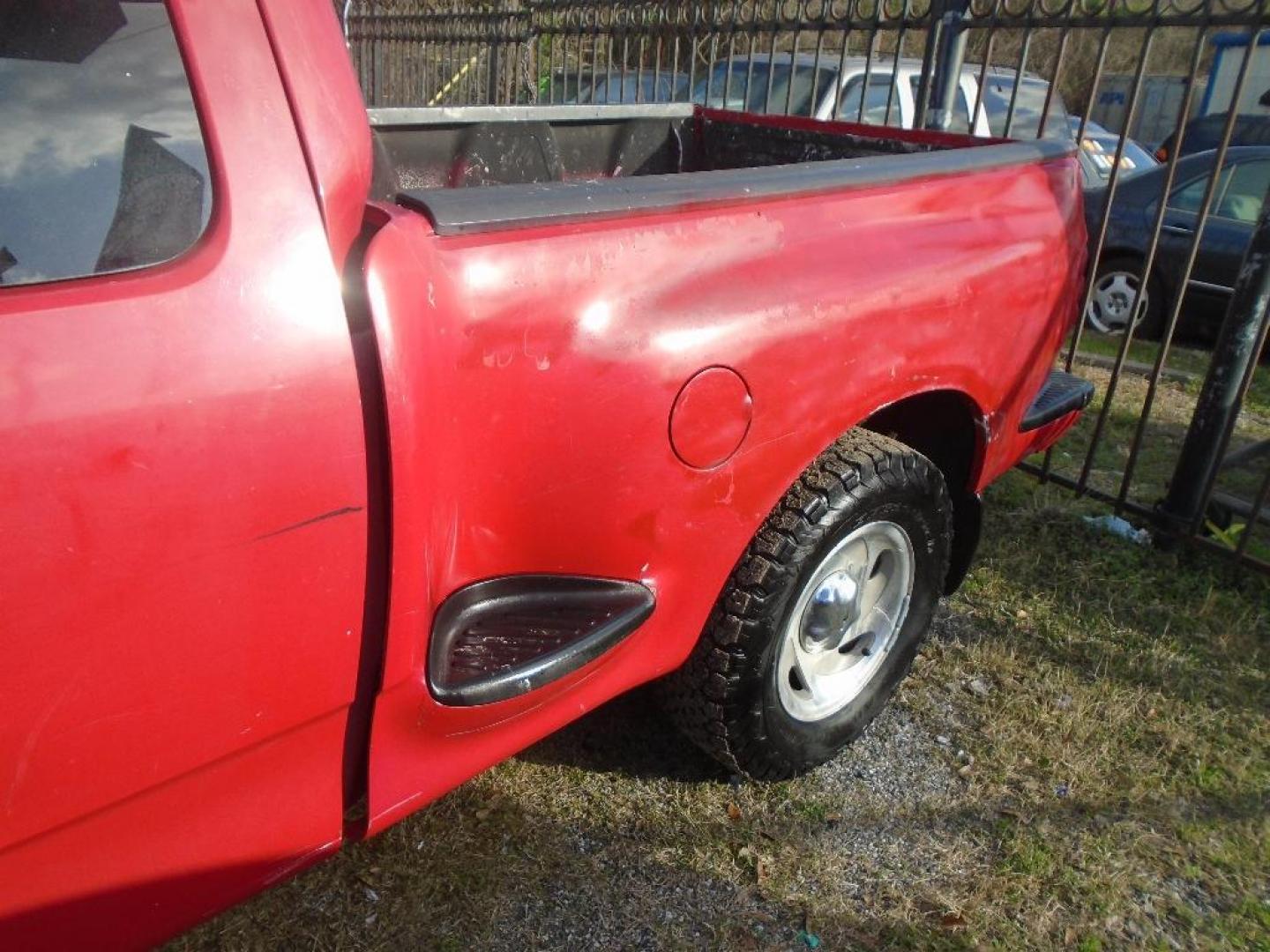 2000 RED FORD F-150 XL SuperCab Flareside 2WD (1FTZX0724YK) with an 4.2L V6 OHV 12V engine, AUTOMATIC transmission, located at 2303 West Mt. Houston, Houston, 77038, (281) 507-3956, 29.771597, -95.339569 - Photo#2