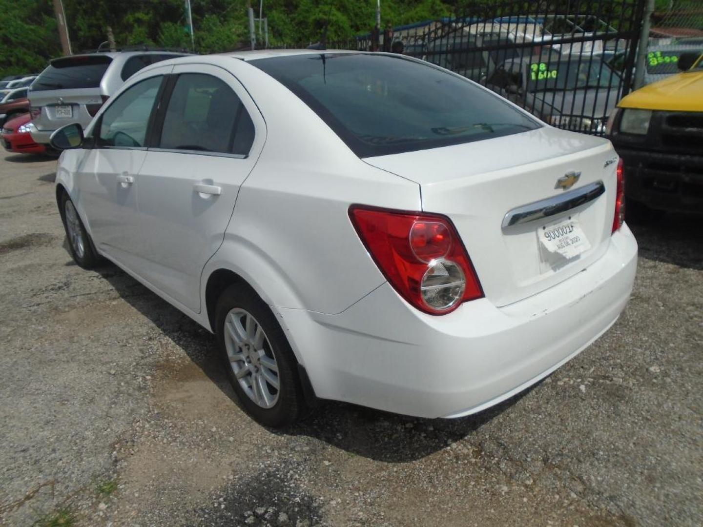 2012 WHITE CHEVROLET SONIC 2LT Sedan (1G1JC5SH9C4) with an 1.8L L4 DOHC 24V engine, AUTOMATIC transmission, located at 2303 West Mt. Houston, Houston, Texas, 77038, (281) 507-3956, 29.771597, -95.339569 - Photo#2