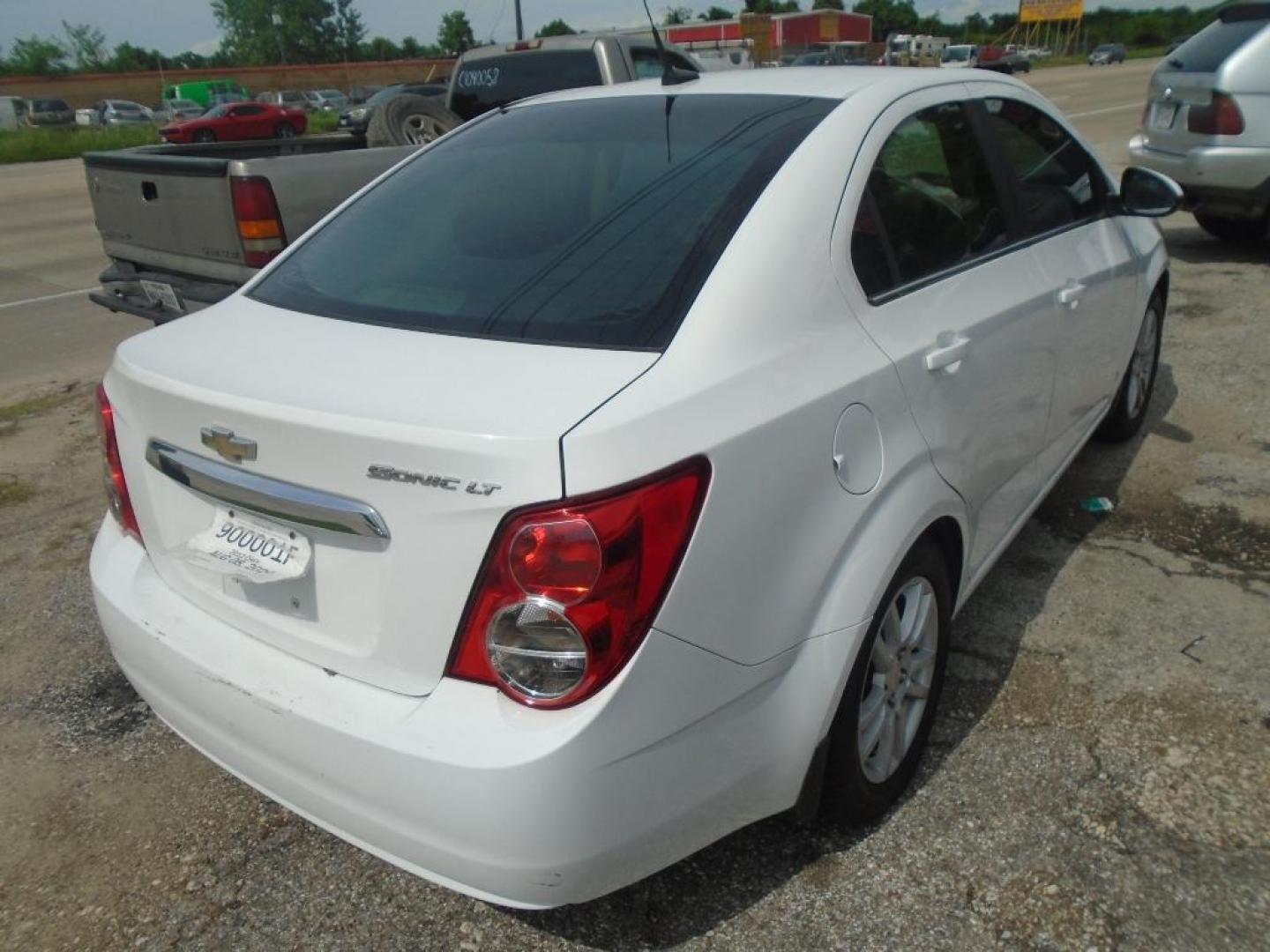 2012 WHITE CHEVROLET SONIC 2LT Sedan (1G1JC5SH9C4) with an 1.8L L4 DOHC 24V engine, AUTOMATIC transmission, located at 2303 West Mt. Houston, Houston, Texas, 77038, (281) 507-3956, 29.771597, -95.339569 - Photo#3