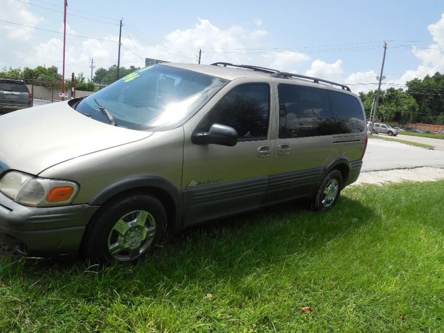 2000 BROWN PONTIAC MONTANA 4-Door Extended (1GMDX03E4YD) with an 3.4L V6 OHV 12V engine, AUTOMATIC transmission, located at 2303 West Mt. Houston, Houston, 77038, (281) 507-3956, 29.771597, -95.339569 - Photo#2