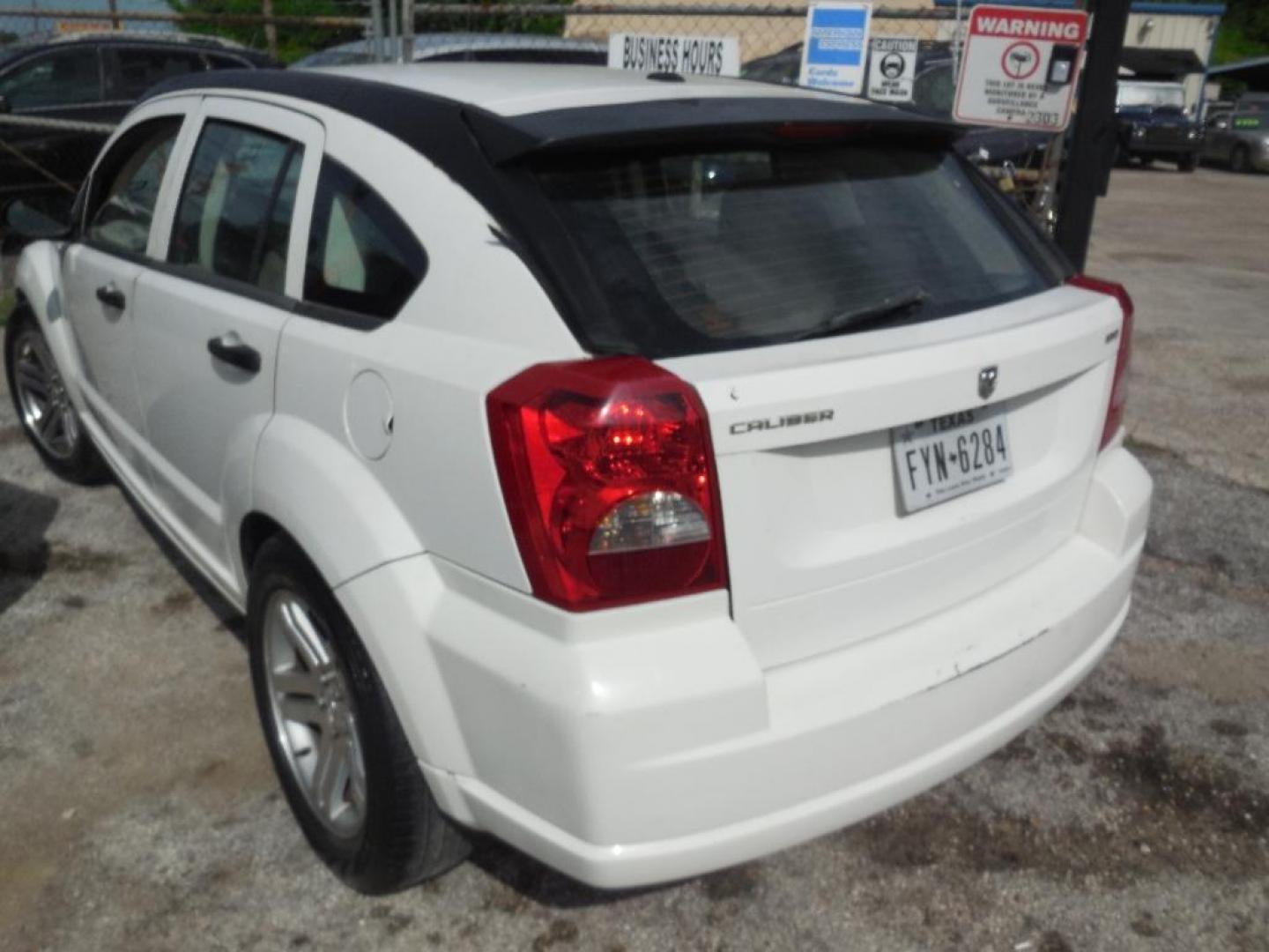 2007 WHITE DODGE CALIBER SE (1B3HB28B97D) with an 2.0L L4 DOHC 16V engine, AUTOMATIC transmission, located at 2303 West Mt. Houston, Houston, Texas, 77038, (281) 507-3956, 29.771597, -95.339569 - Photo#6