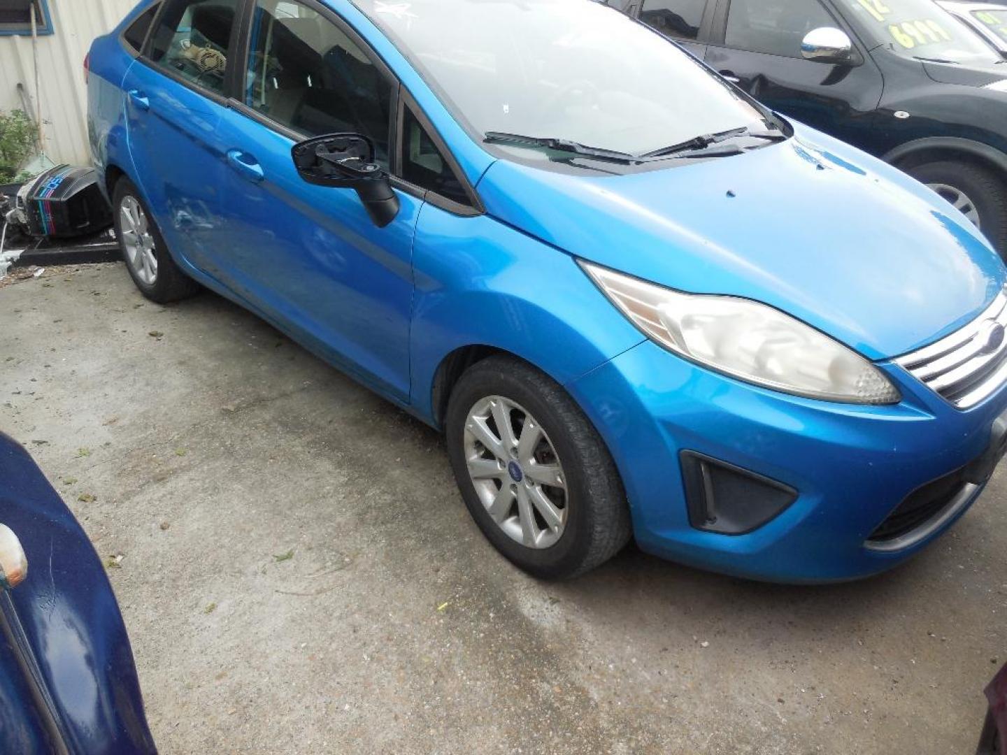 2012 BLUE FORD FIESTA SE Sedan (3FADP4BJ7CM) with an 1.6L L4 DOHC 16V engine, AUTOMATIC transmission, located at 2303 West Mt. Houston, Houston, 77038, (281) 507-3956, 29.771597, -95.339569 - Photo#0