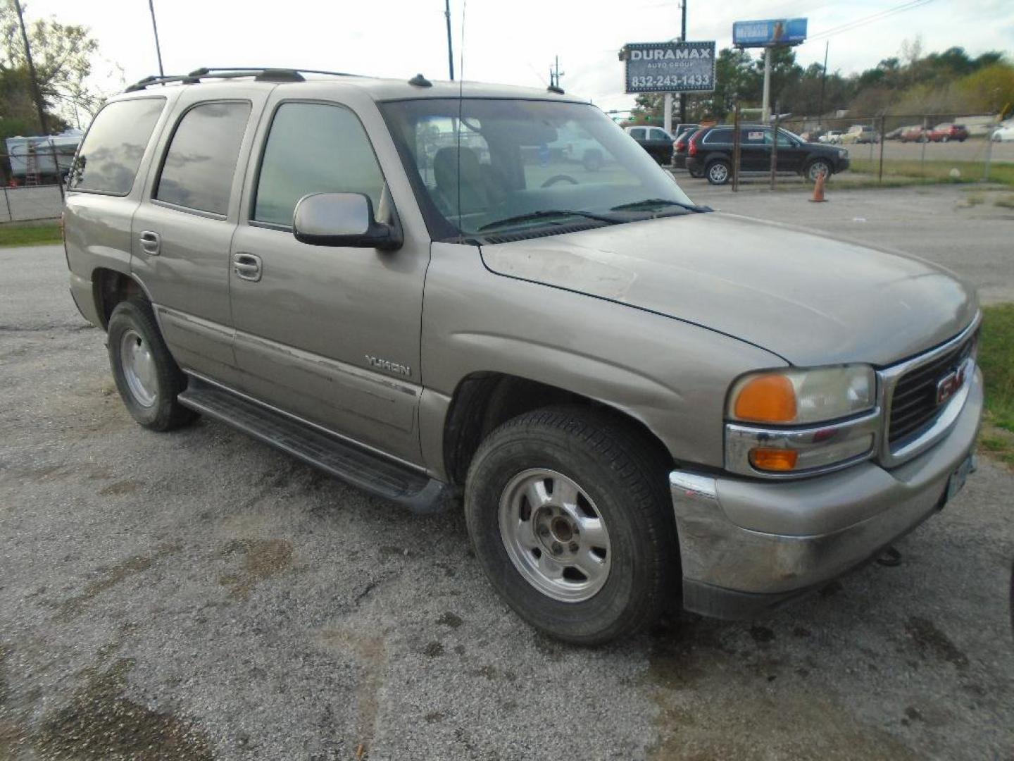 2003 TAN GMC YUKON 2WD (1GKEC13Z03J) with an 5.3L V8 OHV 16V FFV engine, AUTOMATIC transmission, located at 2303 West Mt. Houston, Houston, 77038, (281) 507-3956, 29.771597, -95.339569 - Photo#0